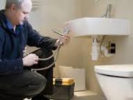 Plumber installing sink in Esher